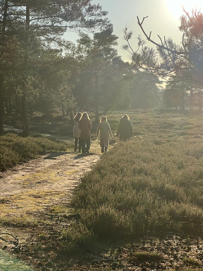 Women walking together at sunrise